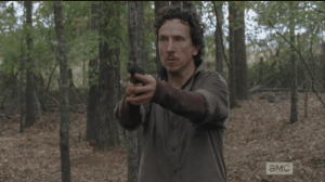 Nicholas is running through the woods, buggin' hard, trying to find Glenn, who he shot, and lost...he sees a figure moving through the trees, raises his gun.