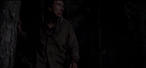 We see Nicholas, limping through the trees...a noise behind him startles him...