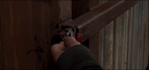...blood and gory bits left on the slide-latch part of the gate...Rick looks down at the ground, sees drops of blood in a line leading into Alexandria.