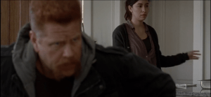 ...Rosita deliberately pushes a metal pan off the counter, and it clatters loudly on the floor.
