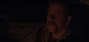 Abraham testifies on Rick's behalf. He informs those gathered at the meeting,