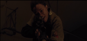 Sasha points the rifle at Gabriel, but cannot bring herself to pull the trigger.
