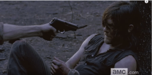 Daryl, who is tied up, lying against a tree, tells the man,