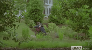 ...Enid, hugging Rowan, who seems distraught over his shitty father's death. As Enid hugs Rowan, her eyes meet Carl's over Rowan's shoulder.