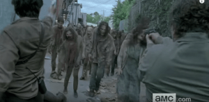It looks like Glenn and Nicholas are holding the line, together, against a huge rush of walkers...inside Alexandria!