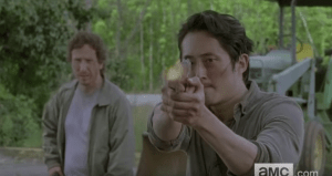 ...and we see Glenn, flanked by Nicholas, standing his ground and firing a gun...hopefully, Nicholas and Glenn have set aside their differences and are working together these days.