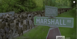 (...especially as we see, in the next shot, a huge horde of walkers, spanning the length of the road, making their way down Reading