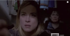 It appears that Jessie and Sam are crouched, hiding in that closet, with Jessie clutching a handgun...