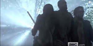 ...but I am not sure who this other guy is. Either Gabriel's been working out, or there's a hot dude that's looking pretty great on Michonne's arm...