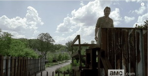 We see Rick survey the view of the outside world beyond the walls of Alexandria's lookout...