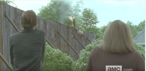 Is that someone on fire getting pitched over the Alexandrian walls, from the inside?