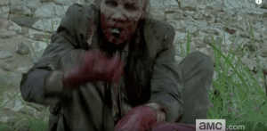 We see yet another horrible image of a walker feasting on some poor somebody...