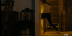 The quick-thinking young girl darts down the hall and ducks out the side doorway towards the kitchen, out of the house before whoever, or whatever, is on the other side of those saloon-style doors can push them open.