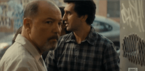 After a moment's hesitation, and a stray rioter bowing up on Chris, the barber concedes to his wife's wishes and lets Travis and his family inside the shop.