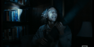 After some digging around in a closet, Nick finds what he is looking for. Madison searches for, and finds, a box of shotgun shells on the top shelf of the closet. She takes the gun and begins loading the shells into it.