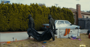 In the next shot, we see military in full-protective clothing carrying off the sad remains of the Cruzes.