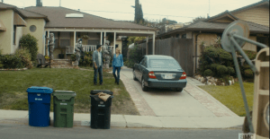 Travis stands in the front yard, watching the military trucks and personnel swarming the neighborhood. Madison walks up beside him. As they stand together, watching, Travis says,