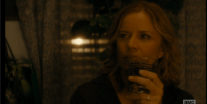 Madison turns to look back out the window, towards her undead neighbor, Su Su.