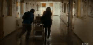 Madison looks with alarm towards the sound, knowing whoever, or whatever tripped the scanner is close. She urges Tobias out of the office and they begin to run, pushing the cart through the hallways...