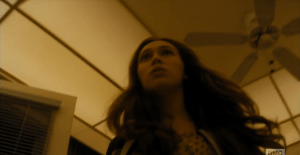 ...Alicia makes her way through the Chans' kitchen, towards the spot where the shells were left in the dining room.