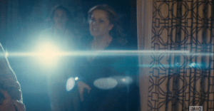 Madison runs in, gun in hand, but Travis, still holding off Dawson B., tells her not to shoot...