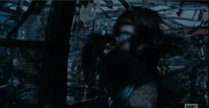 As Alicia rushes past, something grabs her long hair and pulls her hard against the framework wall of the labyrinth...