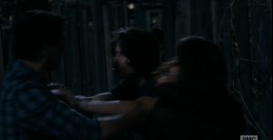 Travis tries to placate his son, telling him to calm down. Chris shoves his father angrily.