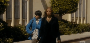 As Madison and Tobias walk away from the school, towards her car...