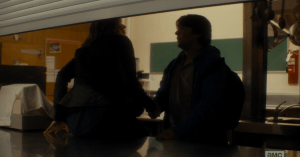 As he helps Madison across the cafeteria's counter, Tobias asks her,
