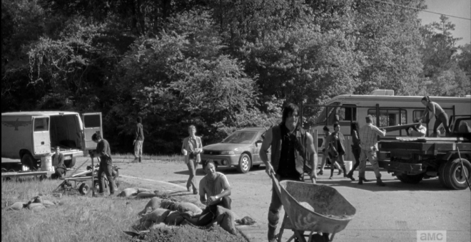 Daryl finished dumping his load, and Rick looks up at him.