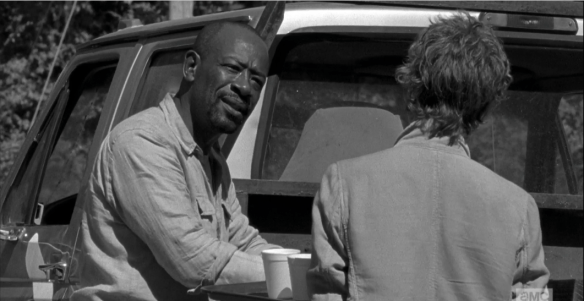 Morgan regards Carol. 