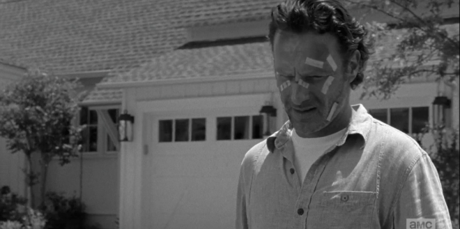 Rick looks down at Daryl.