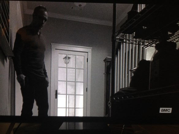 Eugene is so scared now, he falls back, sending an entire shelving unit crashing down. Carter comes around and gapes at the poor mulleted man on the floor.