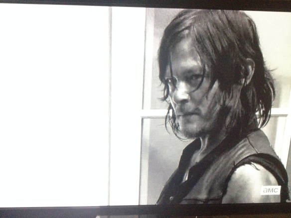Daryl looks up at Rick. 