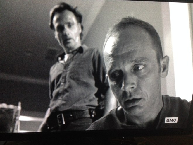 Rick looks down at Carter, who seems like he can't believe he's still alive.