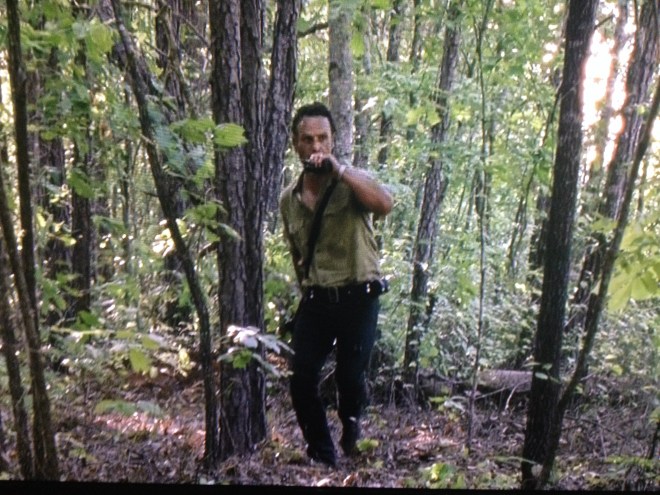 Rick can see the walkers are veering off from the road, but doesn't yet know why...he radios Tobin, then rushes to see what is happening...
