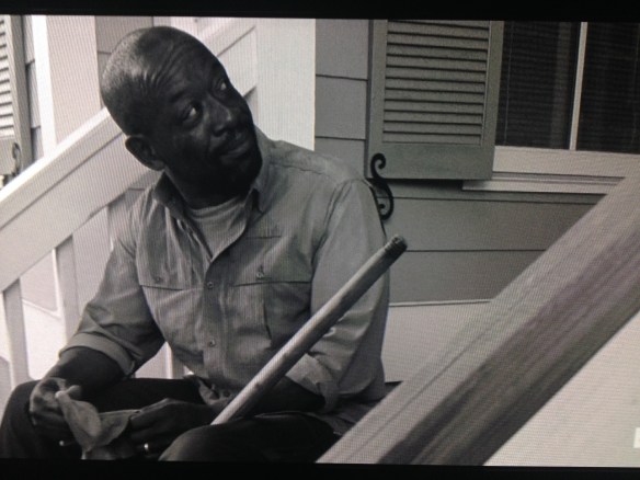 Morgan looks at Rick, pleased. He then looks at Judith, which Rick notices. 