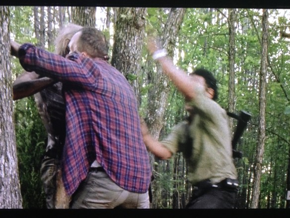 Rick reaches poor Carter, and manages to pry him off the tree walker.