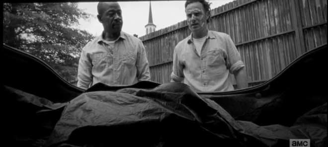 Morgan looks over at Rick.