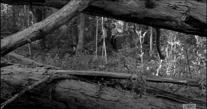As they step their way through the woods, Morgan leading the way, trusty staff in hand, RIck prompts,