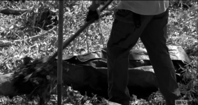 Morgan looks at Rick a moment, says nothing, shrugs off his bag, and begins spearing the shovel into the ground. In the background, there is a quiet roar, the telltale noise of...