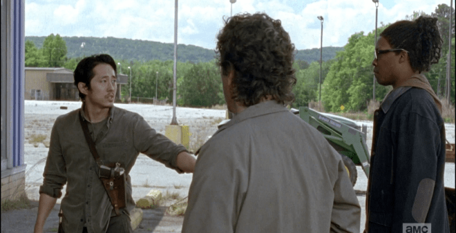 Glenn outlines the plan...they stand back, he and Heath standing at opposite ends, splitting up the walkers when they come out, taking them on.